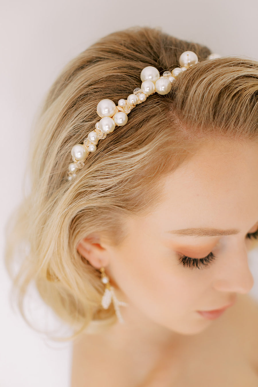 Bride wearing Pearl Wedding headband by Joanna Bisley Designs.