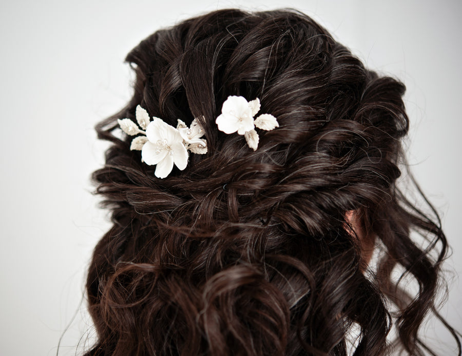 Half up half down bridal hairstyle with bridal pins by Joanna Bisley Designs.
