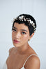 Bride wearing a bridal hairvine made with  large flowers by Joanna Bisley Designs.