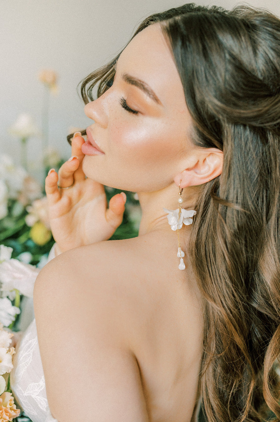 Bride wearing flower wedding earrings by Joanna Bisley Designs.