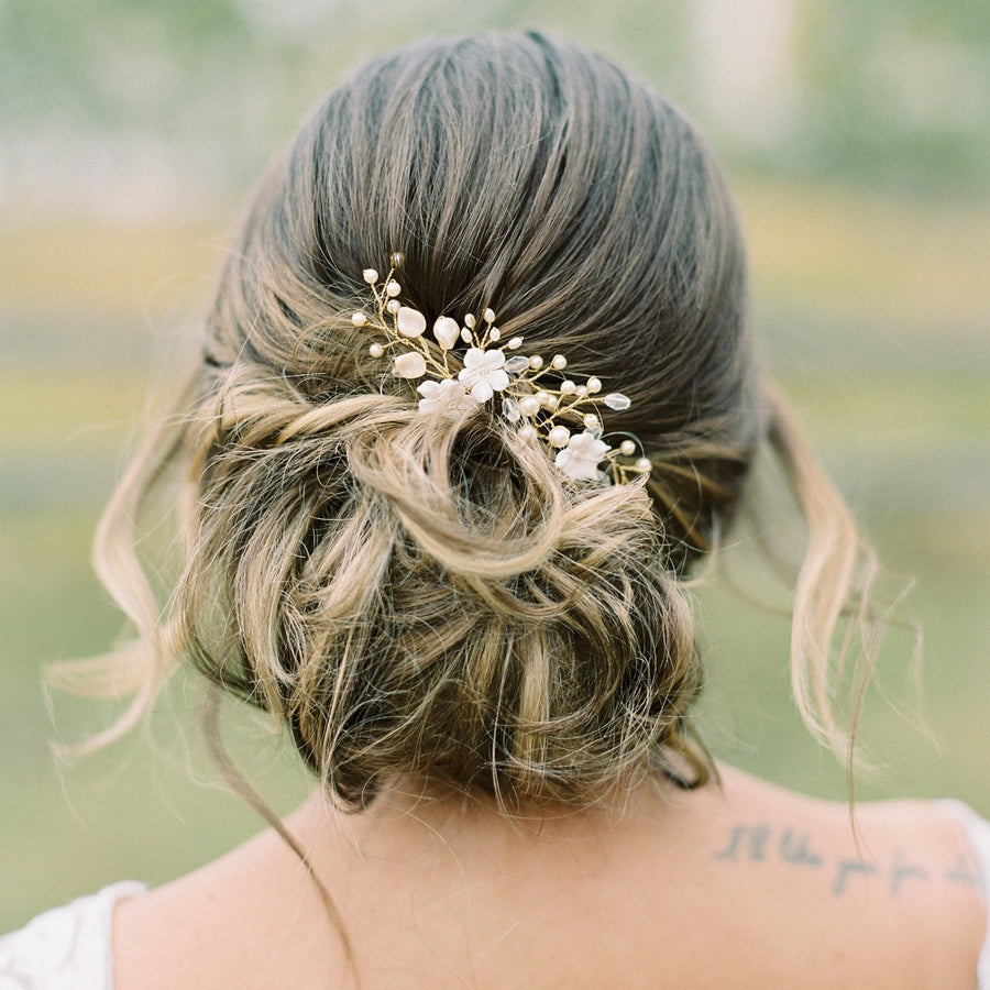 Bride with romantic updo wearing bridal hairpins by Joanna Bisley Designs