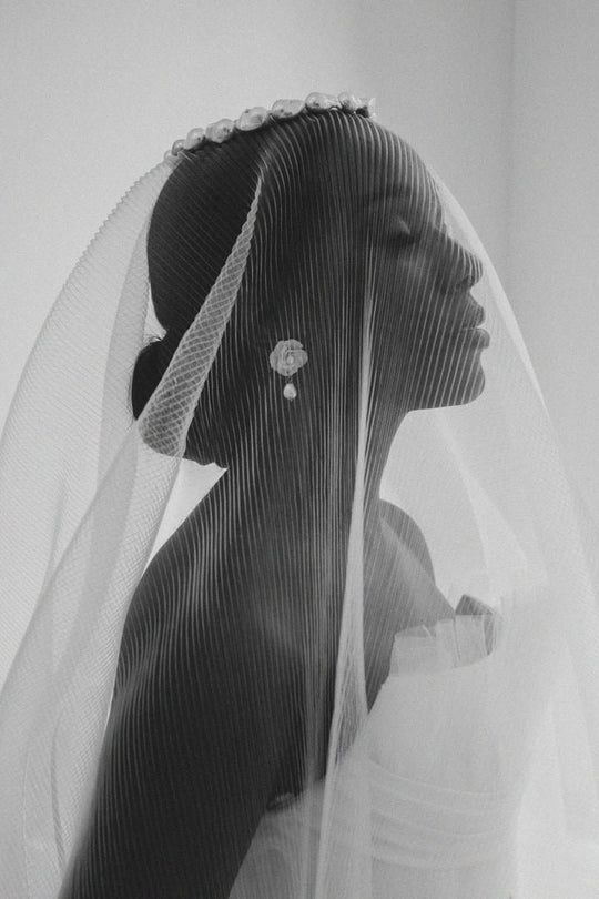 Bride wearing exquisite flower and baroque pearl earrings by Joanna Bisley Designs.