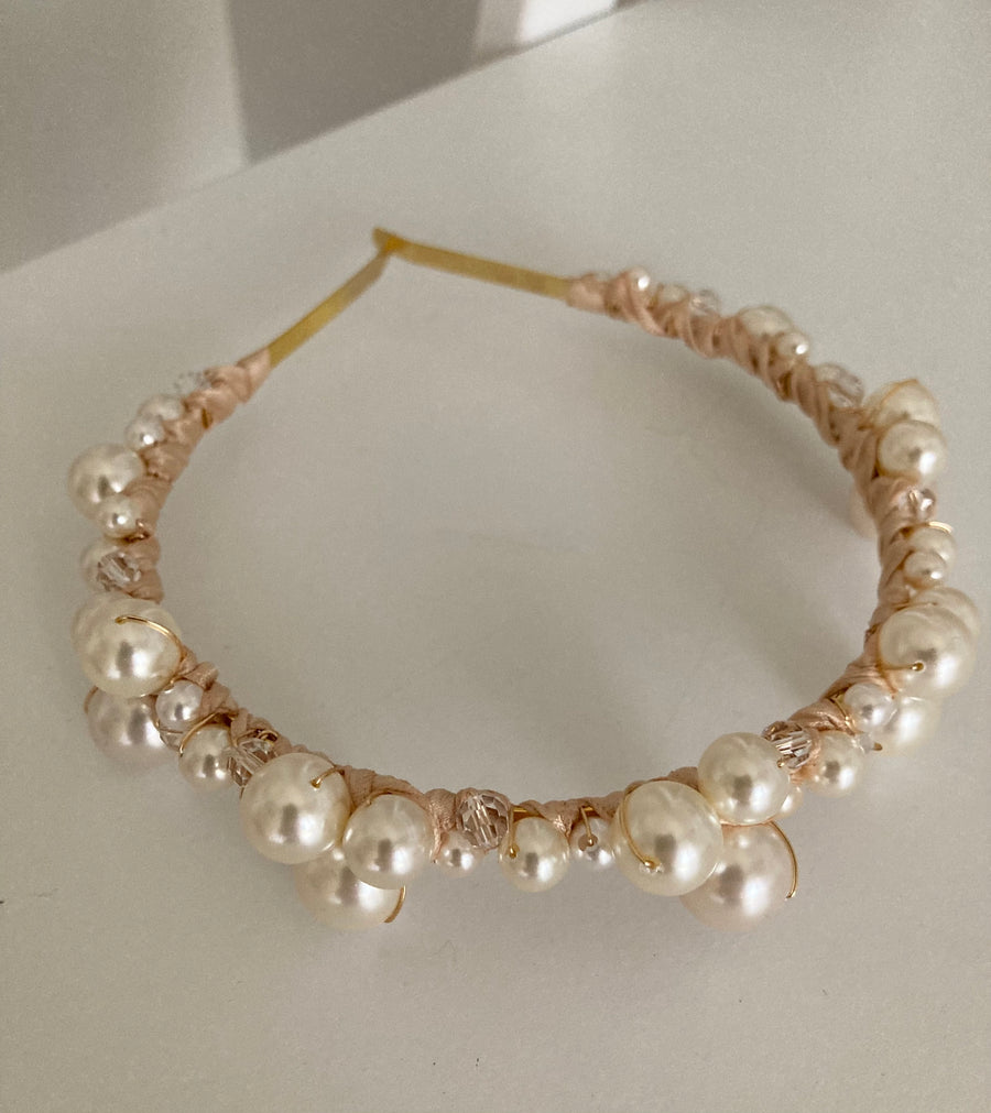Pearl wedding headband made of various sized pearls created by Joanna Bisley Designs.
