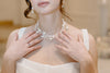 A Vancouver Bride wearing a triple strand baroque pearl bridal choker by Joanna Bisley Designs.