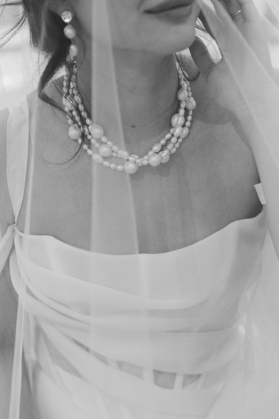Vancouver bride wearing triple strand pearl necklace and baroque pearl earrings by Joanna Bisley Designs.