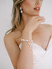 Baroque Pearl and Freshwater Pearl bridal bracelet on bride's wrist.