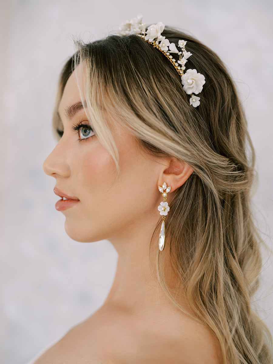 Close up of bride wearing flower bridal crown and crystal wedding earrings by Joanna Bisley Designs.