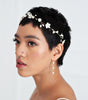 Bride wearing a delicate flower and pearl hairvine by Joanna Bisley Designs