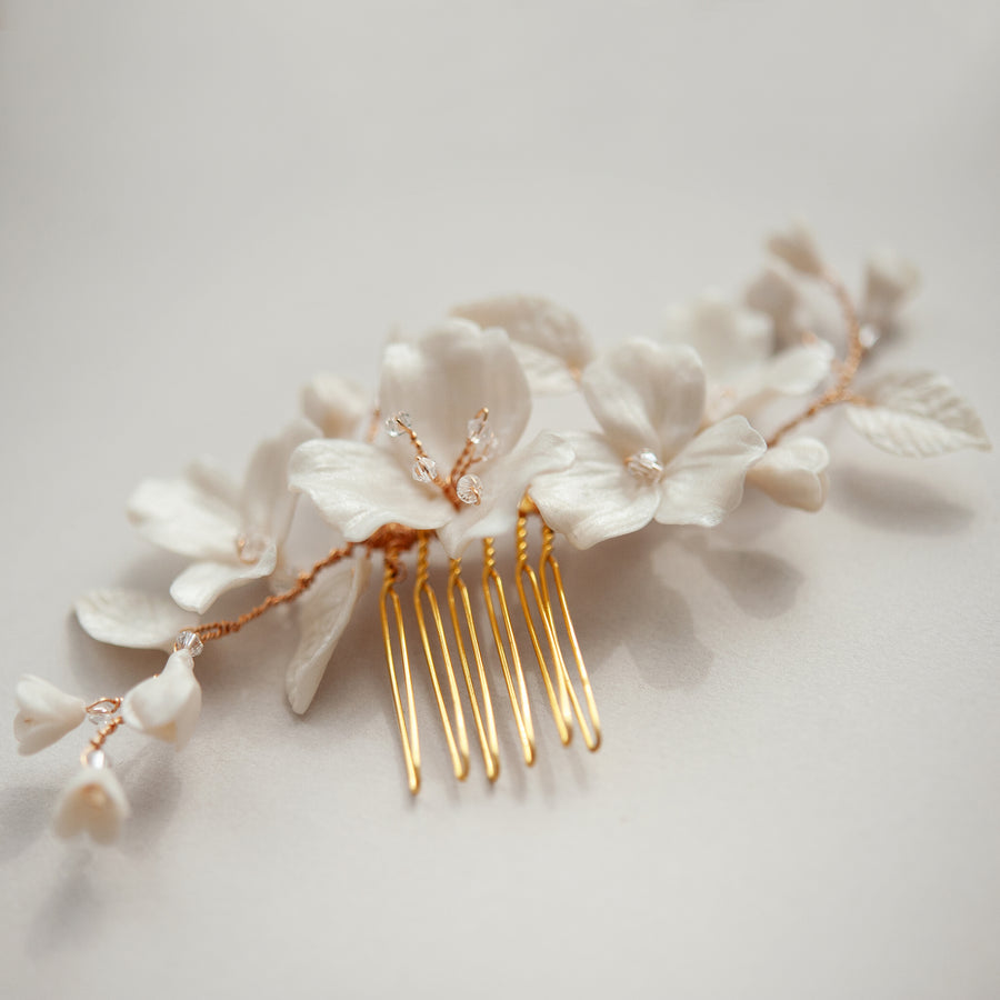 A gold and floral luxury bridal comb by Joanna Bisley Designs.