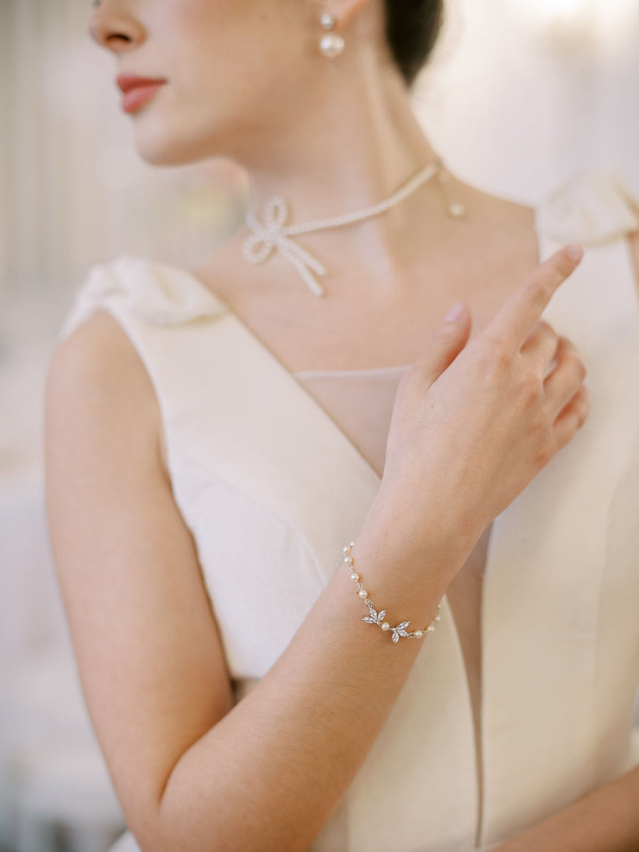 Vancouver bride wearing a pearl bow bridal necklace by Joanna Bisley Designs.