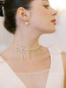 Toronto bride wearing bridal bow pearl necklace with matching pearl earrings.