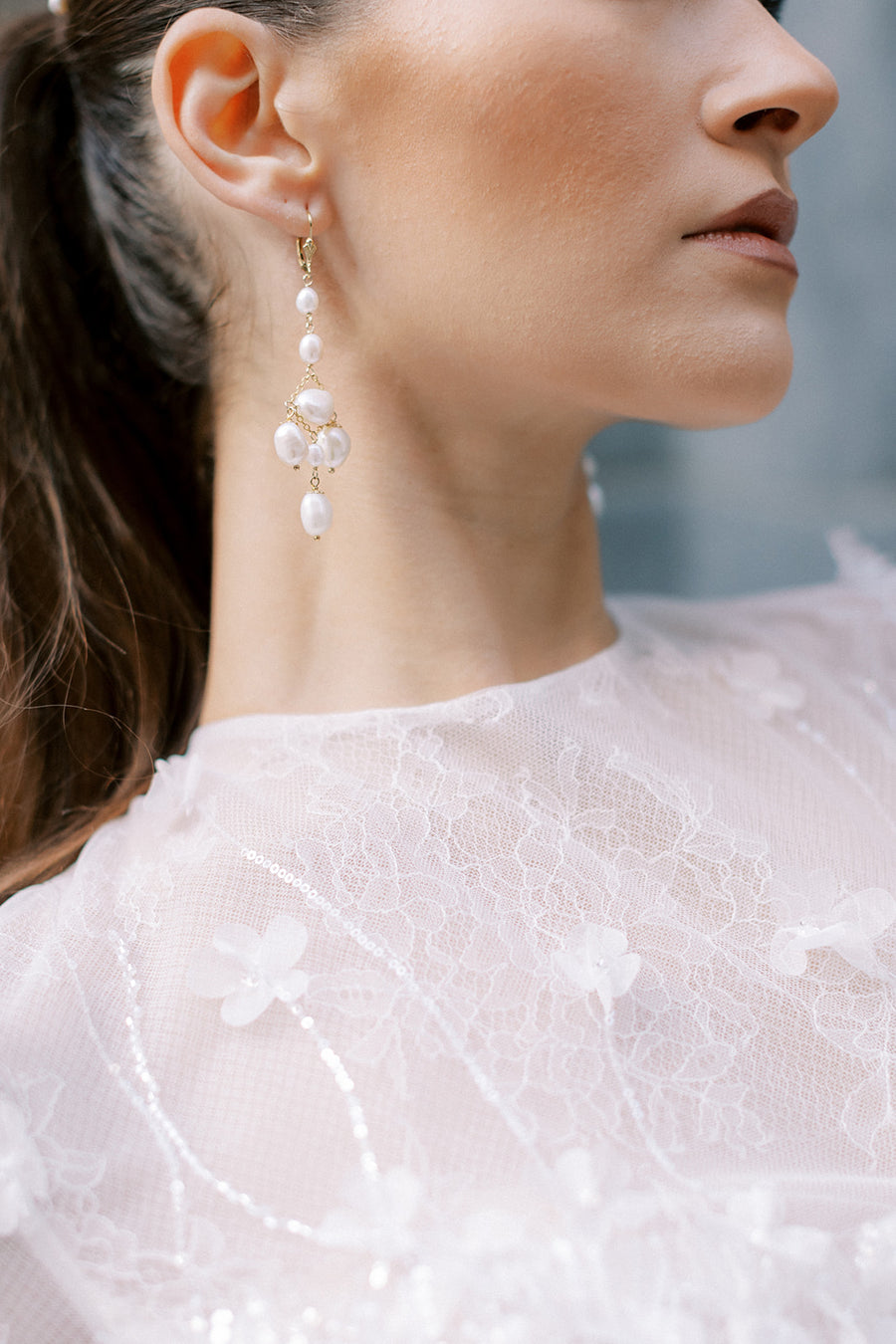 New York bride wearing pearl chandelier wedding earrings by Joanna Bisley Designs.