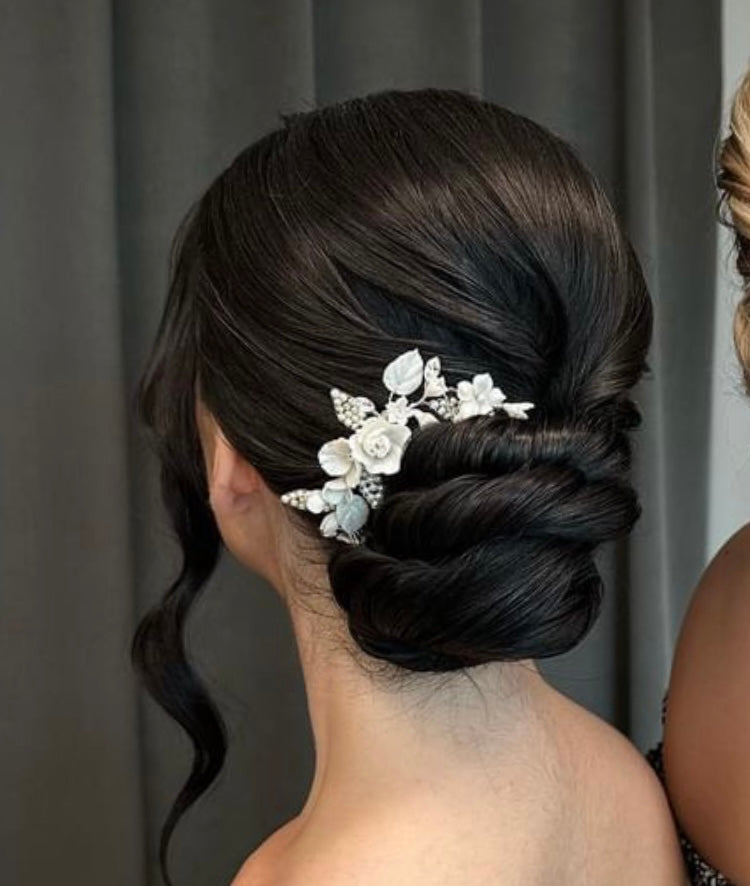A Calgary bride with a beautiful updo wearing a flower and crystal bridal comb by Joanna Bisley Designs.