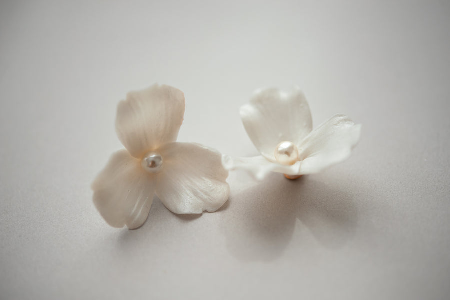 Delicate floral bridal earrings with pearl details by Joanna Bisley Designs.