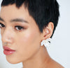 Bride wearing flower bridal stud earrings with pearl detaling.