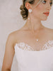 Bride wearing pearl wedding set.