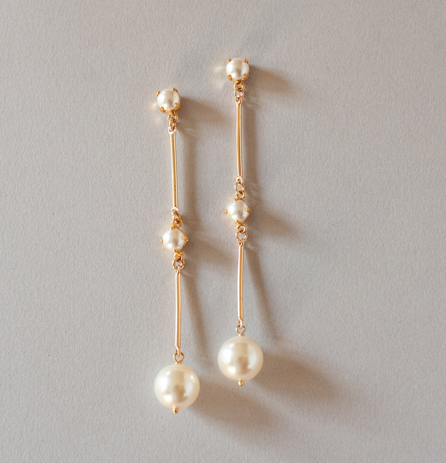 Modern pearl bridal earrings with pearl drop. 