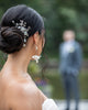Bride wearing blush bridal comb by Joanna Bisley Designs.