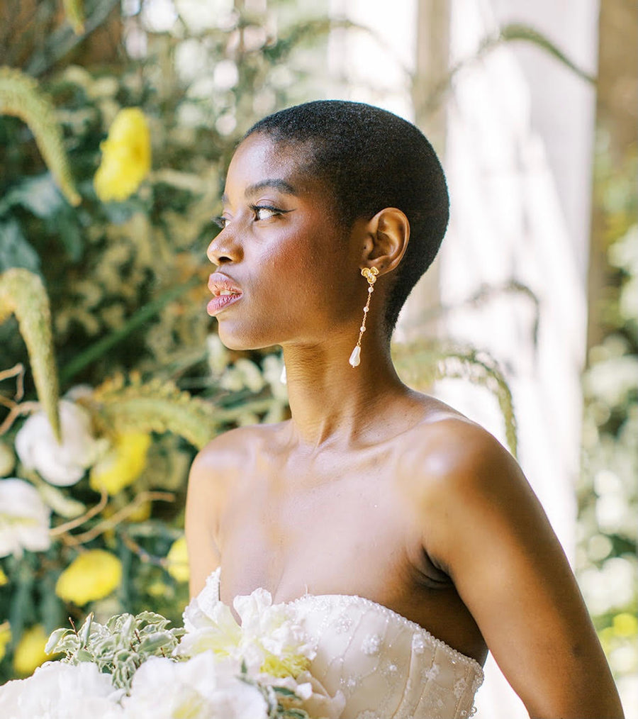 Elegant bride wearing our Neve long pearl drop bridal earrings by Joanna Bisley Designs. 