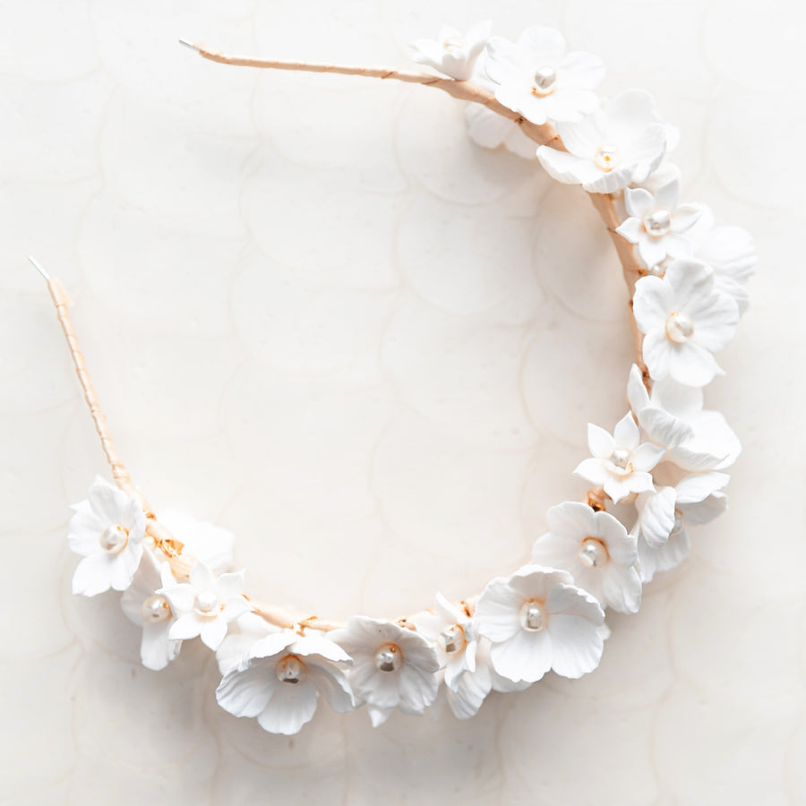 Exquisite romantic flower crown made with clay florals and pearls.