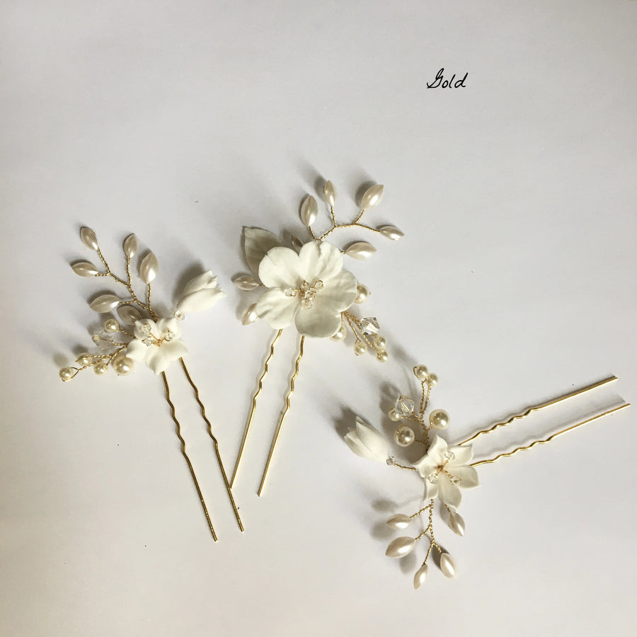 Beautifully handcrafted bridal pins in gold, Swarovski  Crystals and Flowers.