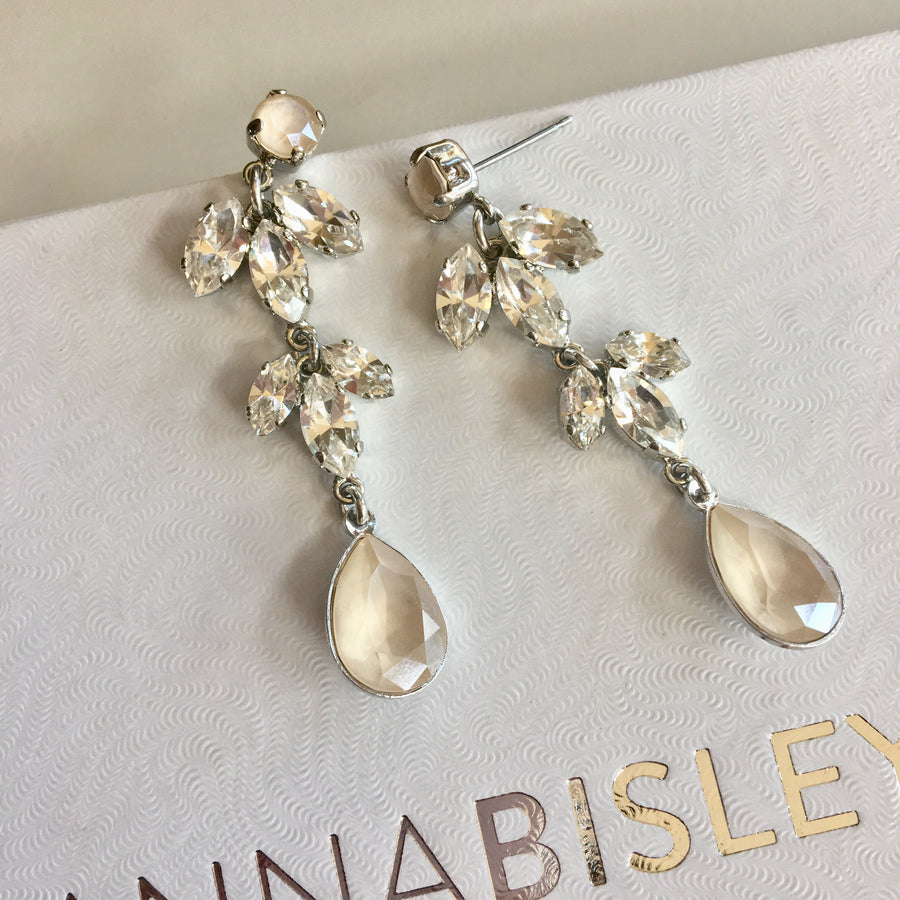 A pair of silver statement bridal earrings.