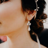 A delicate pearl drop bridal earring with opal and clear Swarovski Crystal by Joanna Bisley Designs.