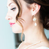 Bride wearing elegant bridal earrings by Joanna Bisley Designs.