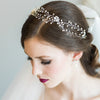 An elegant modern bride wearing a Pearl hairvine with a sleek bridal updo. Handcrafted in Canada. 