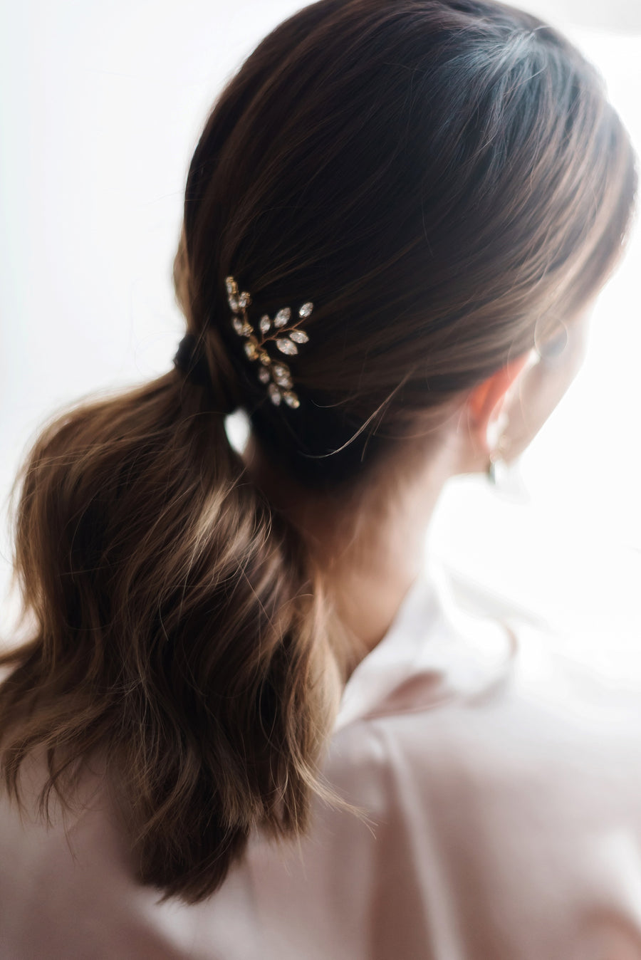 Swarovski Crystal gold bridal pins on a bridal ponytail